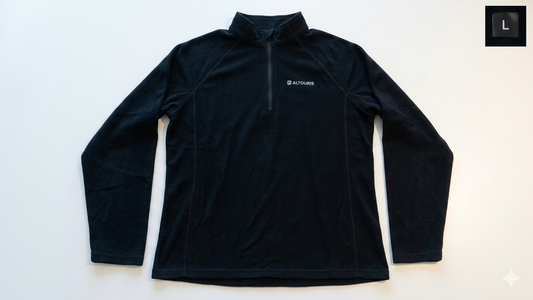 A black long-sleeve quarter-zip pullover top with a small white ALTOURIS logo on the left chest, laid flat on a white background.